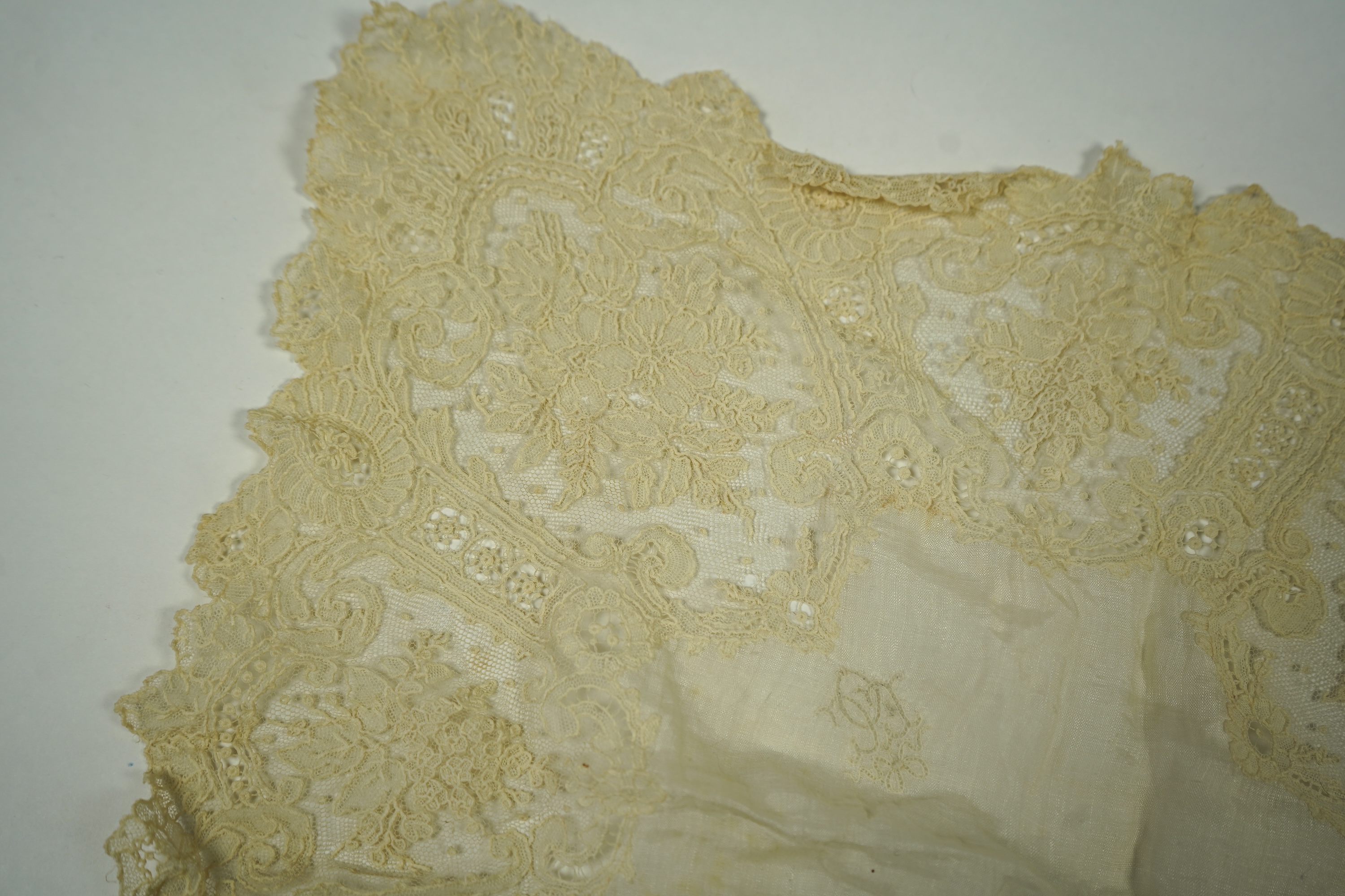 A 19th century Brussels Point de Gaz needle lace collar, lappet and wedding hankie, possibly part of a trousseau. The collar having thirty four needle lace raised flower heads within the design. The collar 100cm long x 1